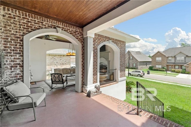 view of patio / terrace with ceiling fan and a porch