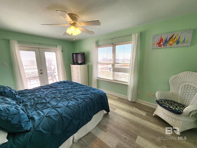 bedroom with access to exterior, french doors, ceiling fan, and light hardwood / wood-style floors