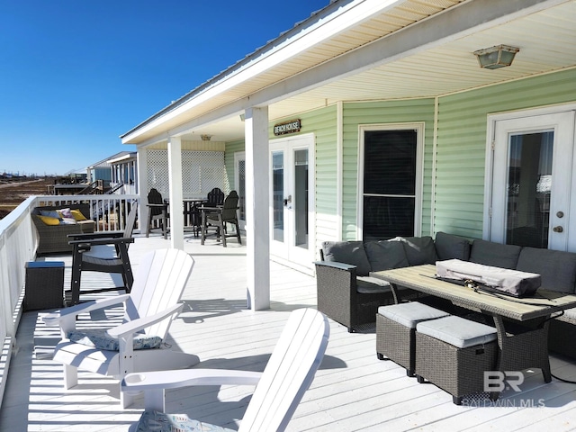 deck with an outdoor hangout area