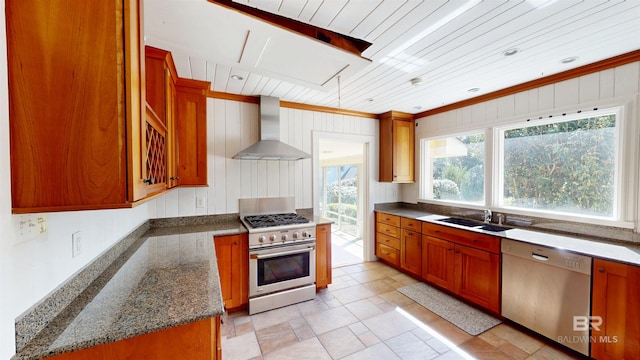 kitchen with a sink, stainless steel appliances, wood ceiling, wall chimney exhaust hood, and brown cabinets