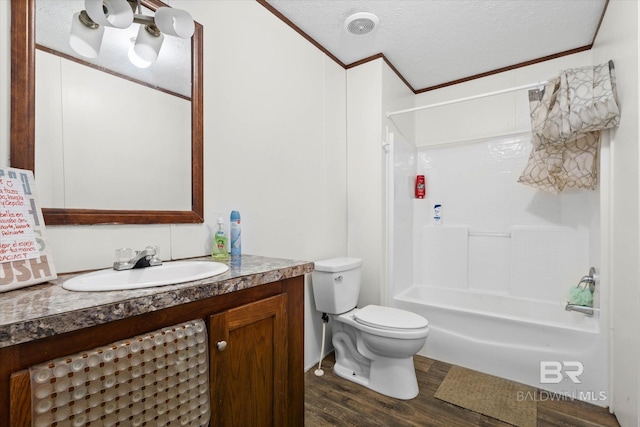 19300 Community Ln, Summerdale, AL 36580 - full bathroom with wood finished floors, vanity, a textured ceiling, bathing tub / shower combination, and toilet