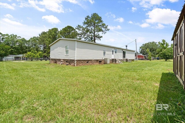 19300 Community Ln, Summerdale, AL 36580 - view of yard featuring central air condition unit