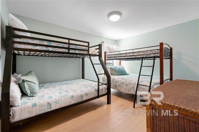 bedroom featuring wood finished floors