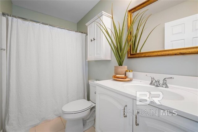 full bathroom featuring vanity and toilet