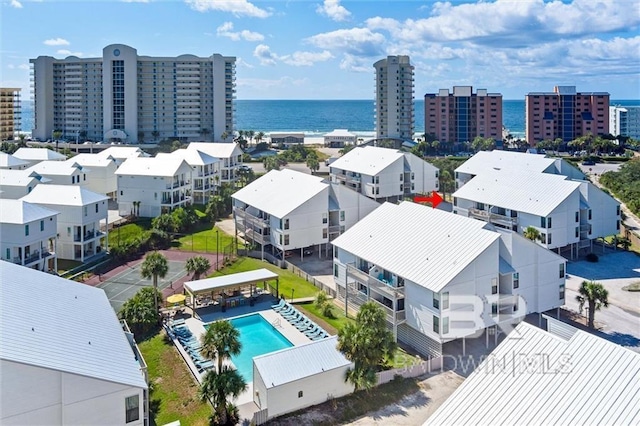 bird's eye view featuring a water view and a view of city