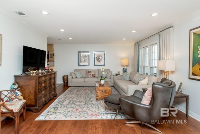 6000 Shenandoah Rd, Mobile, AL 36608 - living room featuring ornamental molding, wood finished floors, recessed lighting, and baseboards