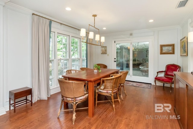 6000 Shenandoah Rd, Mobile, AL 36608 - dining area featuring wood finished floors, crown molding, and recessed lighting