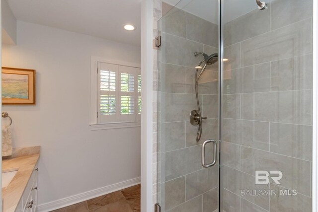 6000 Shenandoah Rd, Mobile, AL 36608 - full bathroom featuring a shower stall, vanity, baseboards, and recessed lighting