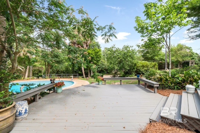 6000 Shenandoah Rd, Mobile, AL 36608 - deck with an outdoor pool and view of scattered trees
