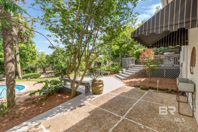6000 Shenandoah Rd, Mobile, AL 36608 - view of patio / terrace featuring an outdoor pool, a wooden deck, and stairs
