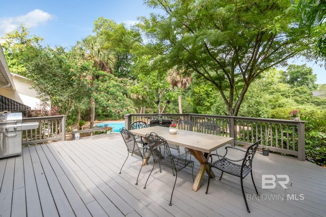 6000 Shenandoah Rd, Mobile, AL 36608 - deck with outdoor dining space, grilling area, and an outdoor pool