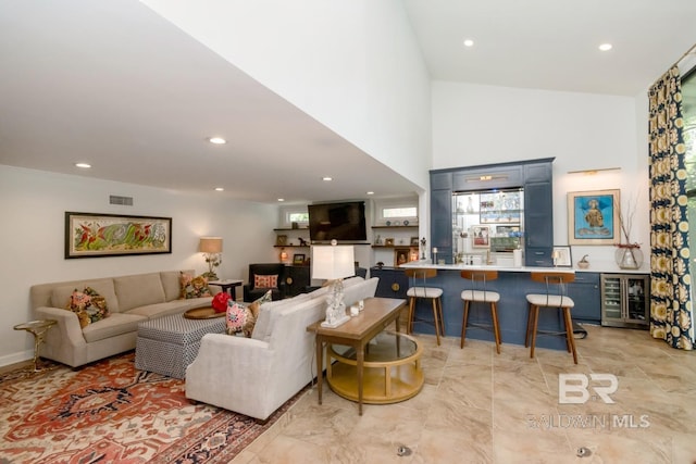 6000 Shenandoah Rd, Mobile, AL 36608 - living room with beverage cooler, light marble finish floors, and recessed lighting