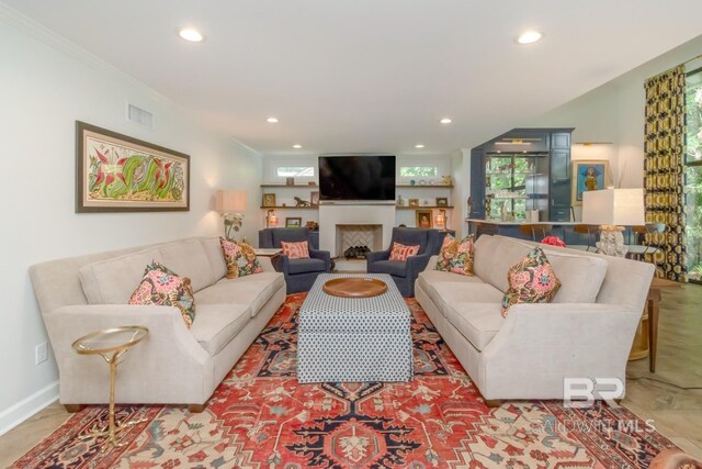 6000 Shenandoah Rd, Mobile, AL 36608 - living room with recessed lighting, plenty of natural light, a fireplace, ornamental molding, and baseboards