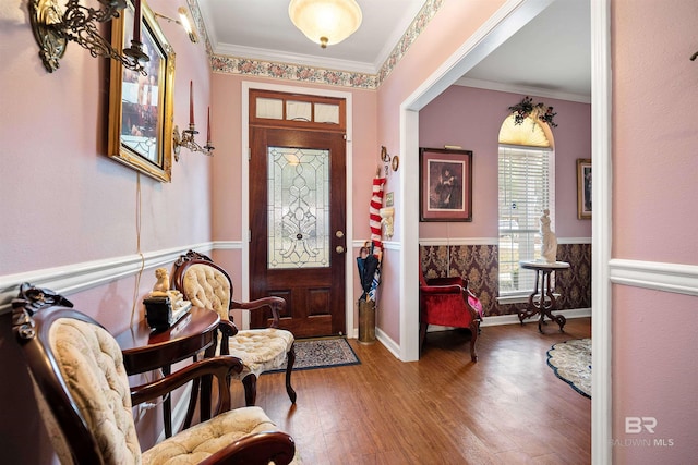 foyer featuring crown molding and hardwood / wood-style flooring