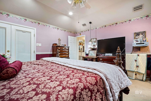 carpeted bedroom with lofted ceiling and ceiling fan