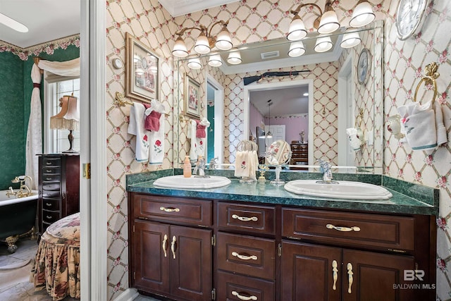 bathroom with crown molding and vanity