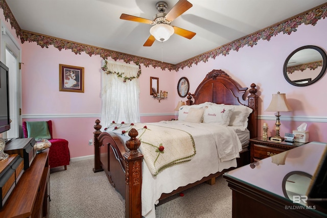 bedroom featuring ceiling fan and light carpet