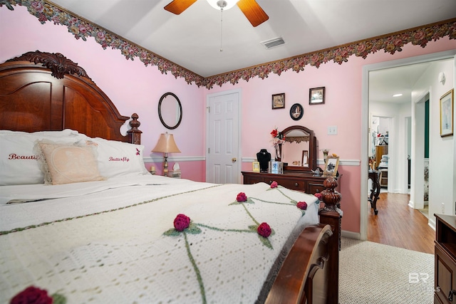 bedroom featuring ceiling fan and light hardwood / wood-style flooring