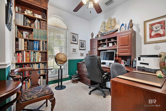 office space with ceiling fan and light carpet