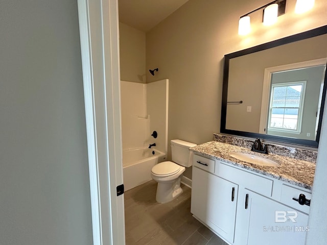 full bathroom featuring vanity, toilet, and  shower combination