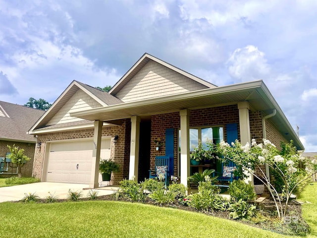 1556 Kairos Loop, Foley, AL 36535 - view of front facade featuring brick siding, a garage, concrete driveway, and a front lawn