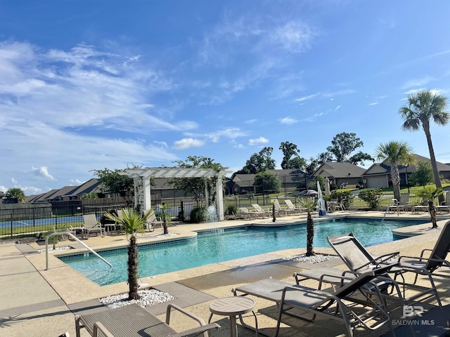 1556 Kairos Loop, Foley, AL 36535 - community pool featuring a patio, a pergola, and a residential view