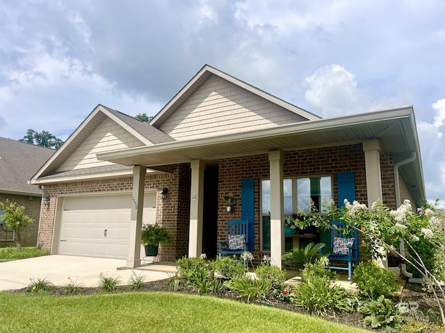 1556 Kairos Loop, Foley, AL 36535 - view of front of house featuring driveway, brick siding, and an attached garage