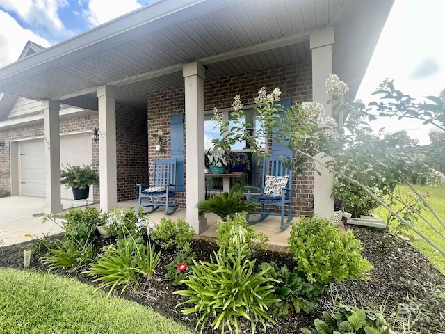 1556 Kairos Loop, Foley, AL 36535 - porch with a garage and concrete driveway