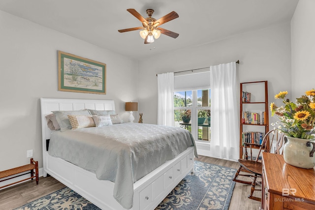 1556 Kairos Loop, Foley, AL 36535 - bedroom with wood finished floors and a ceiling fan