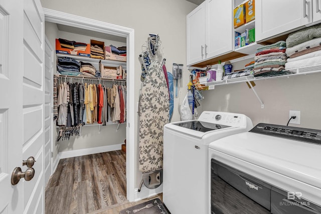 1556 Kairos Loop, Foley, AL 36535 - washroom with cabinet space, washing machine and clothes dryer, and wood finished floors