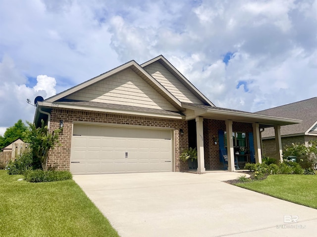 1556 Kairos Loop, Foley, AL 36535 - view of front of property with brick siding, concrete driveway, a garage, and a front yard