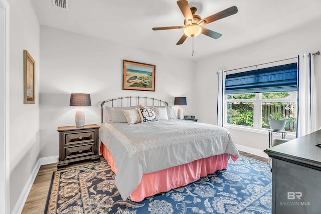 1556 Kairos Loop, Foley, AL 36535 - bedroom with wood finished floors and ceiling fan