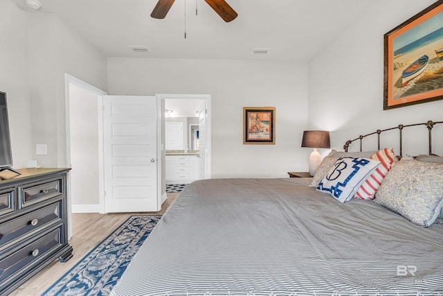 1556 Kairos Loop, Foley, AL 36535 - bedroom with light wood-style floors, ensuite bath, and a ceiling fan