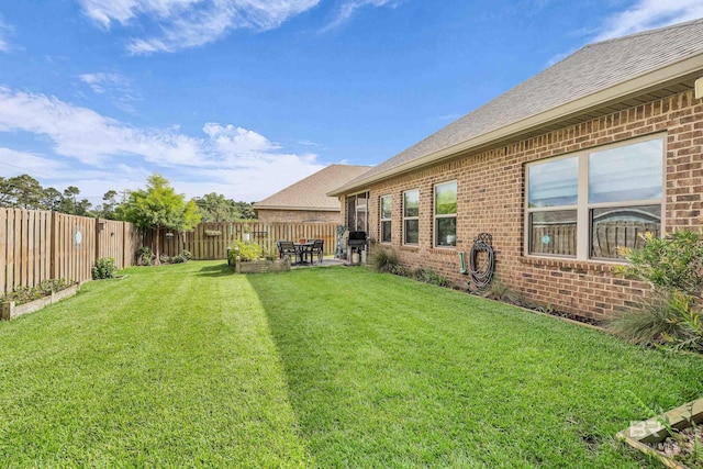 1556 Kairos Loop, Foley, AL 36535 - fenced backyard with a patio