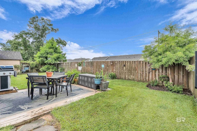 1556 Kairos Loop, Foley, AL 36535 - fenced backyard with a patio