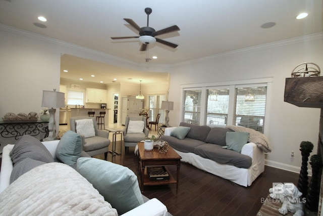 living area featuring baseboards, dark wood-style flooring, recessed lighting, and crown molding