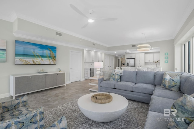 23008 W Perdido Beach Blvd Unit 1905, Orange Beach, AL 36561 - living area featuring a ceiling fan, crown molding, and baseboards