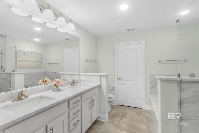 23008 W Perdido Beach Blvd Unit 1905, Orange Beach, AL 36561 - full bath featuring toilet, a shower with door, double vanity, recessed lighting, and baseboards