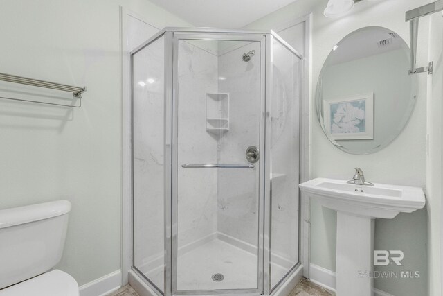 23008 W Perdido Beach Blvd Unit 1905, Orange Beach, AL 36561 - full bath featuring toilet, a stall shower, baseboards, and a sink