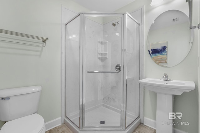 23008 W Perdido Beach Blvd Unit 1905, Orange Beach, AL 36561 - full bathroom with baseboards, a shower stall, and toilet