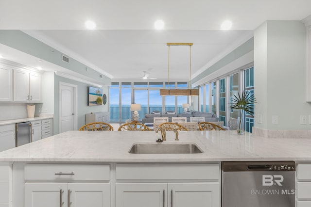 23008 W Perdido Beach Blvd Unit 1905, Orange Beach, AL 36561 - kitchen with dishwasher, a sink, ornamental molding, white cabinetry, and open floor plan