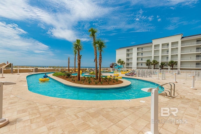 23008 W Perdido Beach Blvd Unit 1905, Orange Beach, AL 36561 - community pool with a patio and fence