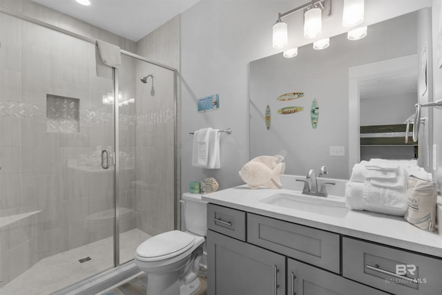 full bath with toilet, a shower stall, and vanity