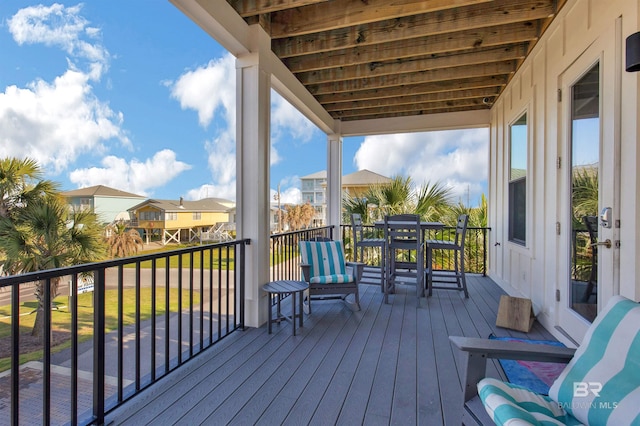 wooden terrace featuring a residential view