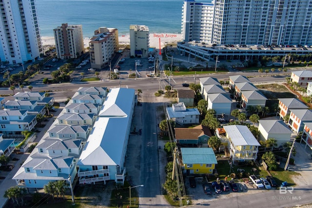 birds eye view of property with a view of city and a water view