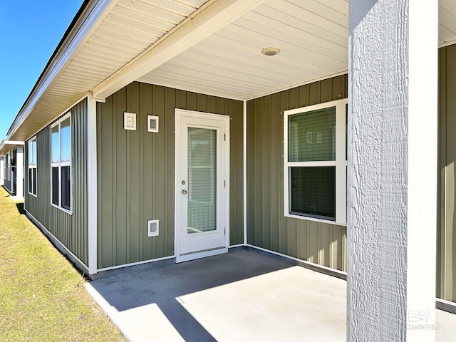 property entrance featuring a patio