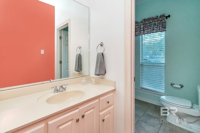 bathroom featuring tile patterned flooring, vanity, and toilet