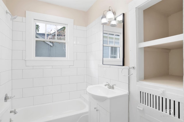 bathroom featuring vanity and bathing tub / shower combination