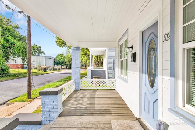 wooden deck with covered porch