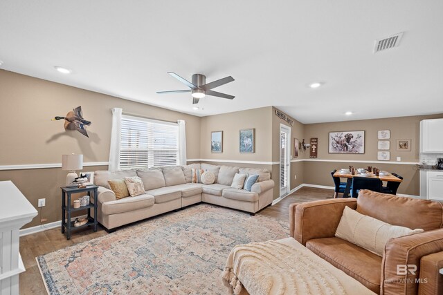 14705 Forsythia Loop, Silverhill, AL 36576 - living area with wood finished floors, ceiling fan, and recessed lighting
